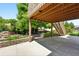 View of the backyard patio, stairs to deck, garden, and landscaping at 517 Rider Ridge Dr, Longmont, CO 80504