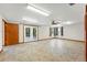 Finished basement with french doors to the back yard, updated lighting and tile flooring at 517 Rider Ridge Dr, Longmont, CO 80504