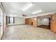 Finished basement featuring neutral colors, updated lighting and built in bookshelves at 517 Rider Ridge Dr, Longmont, CO 80504