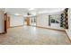 Finished basement with french doors to the back yard, updated lighting and neutral tile flooring at 517 Rider Ridge Dr, Longmont, CO 80504