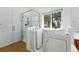 Modern bathroom featuring a walk-in tub, separate glass shower, and wood-look flooring at 517 Rider Ridge Dr, Longmont, CO 80504