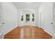 Bedroom with hardwood floors, lots of natural light from windows, and a closet at 517 Rider Ridge Dr, Longmont, CO 80504