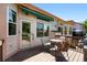 Spacious deck with table and chairs outside sliding glass doors and awning at 517 Rider Ridge Dr, Longmont, CO 80504