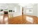 Bright dining area with hardwood floors, modern chandelier, and large window at 517 Rider Ridge Dr, Longmont, CO 80504