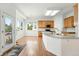 Open kitchen featuring granite countertops, stainless appliances, an eat-in nook, and wood cabinets at 517 Rider Ridge Dr, Longmont, CO 80504