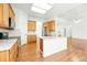 Bright kitchen featuring granite countertops, stainless appliances, and wood cabinets at 517 Rider Ridge Dr, Longmont, CO 80504