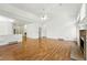 Bright living room with hardwood floors, vaulted ceilings, and a cozy fireplace at 517 Rider Ridge Dr, Longmont, CO 80504
