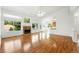Open-concept living space with hardwood floors, fireplace, and seamless flow to the kitchen at 517 Rider Ridge Dr, Longmont, CO 80504