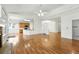 Spacious living area featuring hardwood floors, fireplace, and seamless flow to the kitchen at 517 Rider Ridge Dr, Longmont, CO 80504