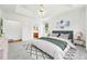 Main bedroom with carpet and a tray ceiling, with an en suite at 517 Rider Ridge Dr, Longmont, CO 80504