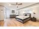 Bright bedroom featuring hardwood floors and ceiling fan at 1777 Larimer St # 1908, Denver, CO 80202