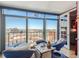 Bright living room with panoramic city views and comfortable seating area. A large sliding glass doors provide lots of natural light at 1777 Larimer St # 1908, Denver, CO 80202