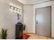 Bright entryway with hardwood floors, modern light fixture and art piece at 1777 Larimer St # 1908, Denver, CO 80202