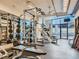 Well-equipped gym with weight machines and mirrors at 1777 Larimer St # 1908, Denver, CO 80202