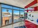 Home office with city views and built-in red shelving at 1777 Larimer St # 1908, Denver, CO 80202