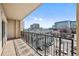 The balcony features city views and a decorative wrought iron railing at 975 N Lincoln St # 3E, Denver, CO 80203