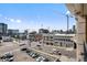 Enjoy the urban views from the balcony overlooking city buildings and a parking lot at 975 N Lincoln St # 3E, Denver, CO 80203
