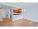 Dining area with views of kitchen, wood flooring, and ample natural light at 975 N Lincoln St # 3E, Denver, CO 80203