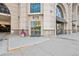 Building entrance at 975 with modern glass doors and a salon located on the main level at 975 N Lincoln St # 3E, Denver, CO 80203