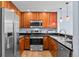 Close-up view of kitchen with stainless steel appliances and dark granite countertops at 975 N Lincoln St # 3E, Denver, CO 80203