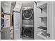 A convenient laundry room features a stacked washer and dryer for efficiency at 975 N Lincoln St # 3E, Denver, CO 80203