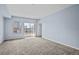 Bright living room with balcony access showcasing city views at 975 N Lincoln St # 3E, Denver, CO 80203