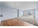 Spacious living room with hardwood floors, carpet, and sliding glass doors to a balcony at 975 N Lincoln St # 3E, Denver, CO 80203