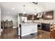 Spacious kitchen featuring dark cabinetry, stainless steel appliances and center island at 22391 E Plymouth Cir, Aurora, CO 80016