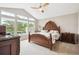 Spacious main bedroom with vaulted ceiling, large window, and elegant furnishings at 22391 E Plymouth Cir, Aurora, CO 80016