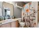 Bathroom features a vanity with a sink and decorative shower curtain at 16031 W 63Rd Ln # D, Arvada, CO 80403