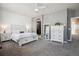 Spacious bedroom with neutral tones, a large bed, and stylish furnishings at 16031 W 63Rd Ln # D, Arvada, CO 80403