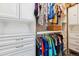 A well-organized closet with custom shelving and hanging rods provides ample storage space at 16031 W 63Rd Ln # D, Arvada, CO 80403