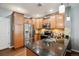 Well-appointed kitchen featuring granite countertops, stainless steel appliances, and ample cabinet space at 16031 W 63Rd Ln # D, Arvada, CO 80403