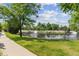Community pond with fountain and landscaping at 16031 W 63Rd Ln # D, Arvada, CO 80403