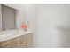 Contemporary bathroom featuring a modern vanity and large mirror at 4737 E Iliff Ave, Denver, CO 80222