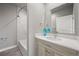 Stylish bathroom with a tub and shower combination and modern vanity offers a relaxing spa-like experience at 4737 E Iliff Ave, Denver, CO 80222