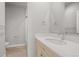 Modern bathroom with sleek fixtures, including an elegant sink and a shower with pristine tiling at 4737 E Iliff Ave, Denver, CO 80222