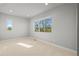 Cozy bedroom featuring carpet and a bright window at 4737 E Iliff Ave, Denver, CO 80222