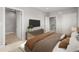 Serene bedroom with adjacent bathroom and staircase entrances, offering convenience and privacy at 4737 E Iliff Ave, Denver, CO 80222
