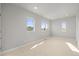 Sun-filled bedroom with carpet, recessed lighting, and large windows at 4737 E Iliff Ave, Denver, CO 80222