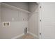 Convenient laundry room with shelf and tile flooring at 4737 E Iliff Ave, Denver, CO 80222