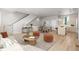 Inviting living room showcasing an open floor plan, hardwood floors, and modern decor at 4737 E Iliff Ave, Denver, CO 80222