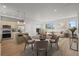Living room featuring an open-concept layout with a modern kitchen and dining area at 4737 E Iliff Ave, Denver, CO 80222