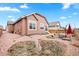 Charming backyard featuring a gravel area with outdoor seating and a view of neighboring homes at 8552 W San Juan Ave, Littleton, CO 80128