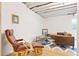 This finished basement showcases a cozy seating area with a brown leather sofa and chair at 8552 W San Juan Ave, Littleton, CO 80128