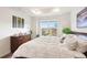Bright bedroom with recessed lighting, large windows, and neutral colors that create a relaxing atmosphere at 8552 W San Juan Ave, Littleton, CO 80128
