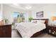 Bedroom features a comfortable bed, ample natural light, and stylish decor for a relaxing atmosphere at 8552 W San Juan Ave, Littleton, CO 80128