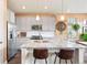 Modern kitchen featuring stainless steel appliances, granite countertops, and stylish pendant lighting at 8552 W San Juan Ave, Littleton, CO 80128