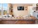 Cozy living room showcasing a comfortable sofa, hardwood floors, and stylish decor at 8552 W San Juan Ave, Littleton, CO 80128