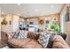 Comfortable living space showcasing an open layout and seamless flow into the adjacent kitchen at 8552 W San Juan Ave, Littleton, CO 80128